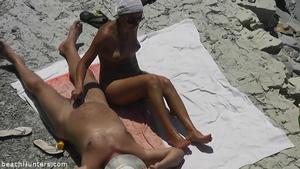 Couple cuddling on the beach