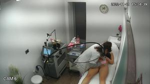 Spying on pretty naked girl during laser hair removal treatment