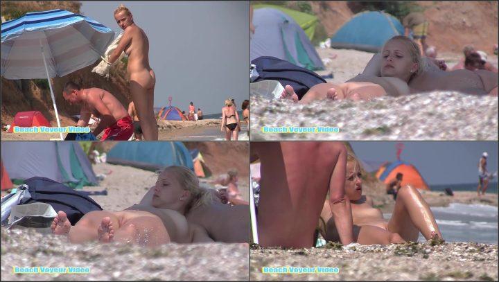 Hot blonde lying naked on the beach