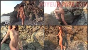 Naked gold digger singing and dancing on tropical beach
