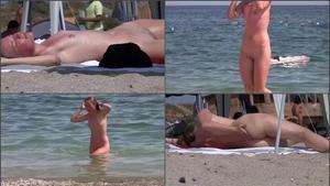 Nudist girl loves getting dirty in sand