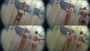 Naked ass bends over in hostel shower room