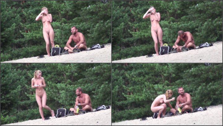 Voyeur zooms on young nudist couple