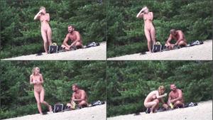 Voyeur zooms on young nudist couple