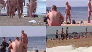 Voyeur checks out nudist friends on the beach