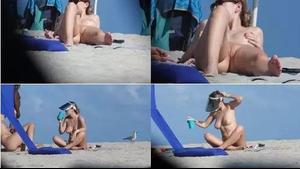 Nudist milf suntans with her legs spread open