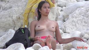 Beautiful young topless tits on beach