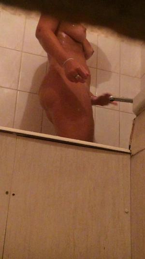 Spying a naked busty girl wash herself in bathroom