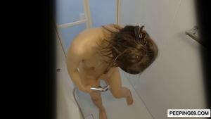 (Resale) Voyeur video of a cheeky gal with good looks taking a shower. Her sharp nipples and shaved pussy are very erotic.