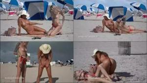Two hotties in thong bikinis on the beach