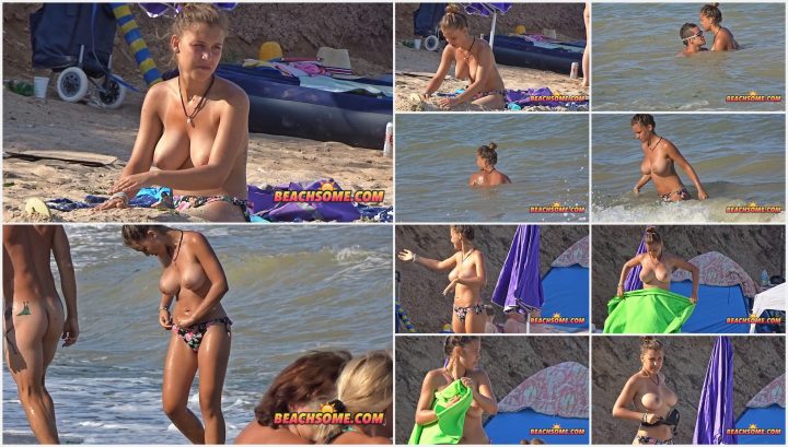 Beautiful topless girl explains something serious