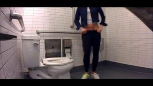 Fit jogger caught peeing in public toilet