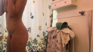 Hidden cam caught young naked milf in shower
