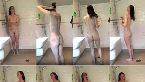 Spying on fit blonde in shower and shaving pussy