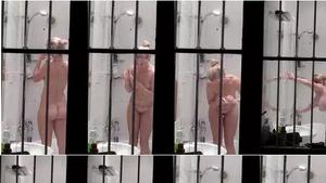 Window peep on hot naked neighbor when she turns on lights