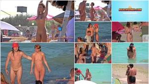 Shiny body of hot nudist woman on beach